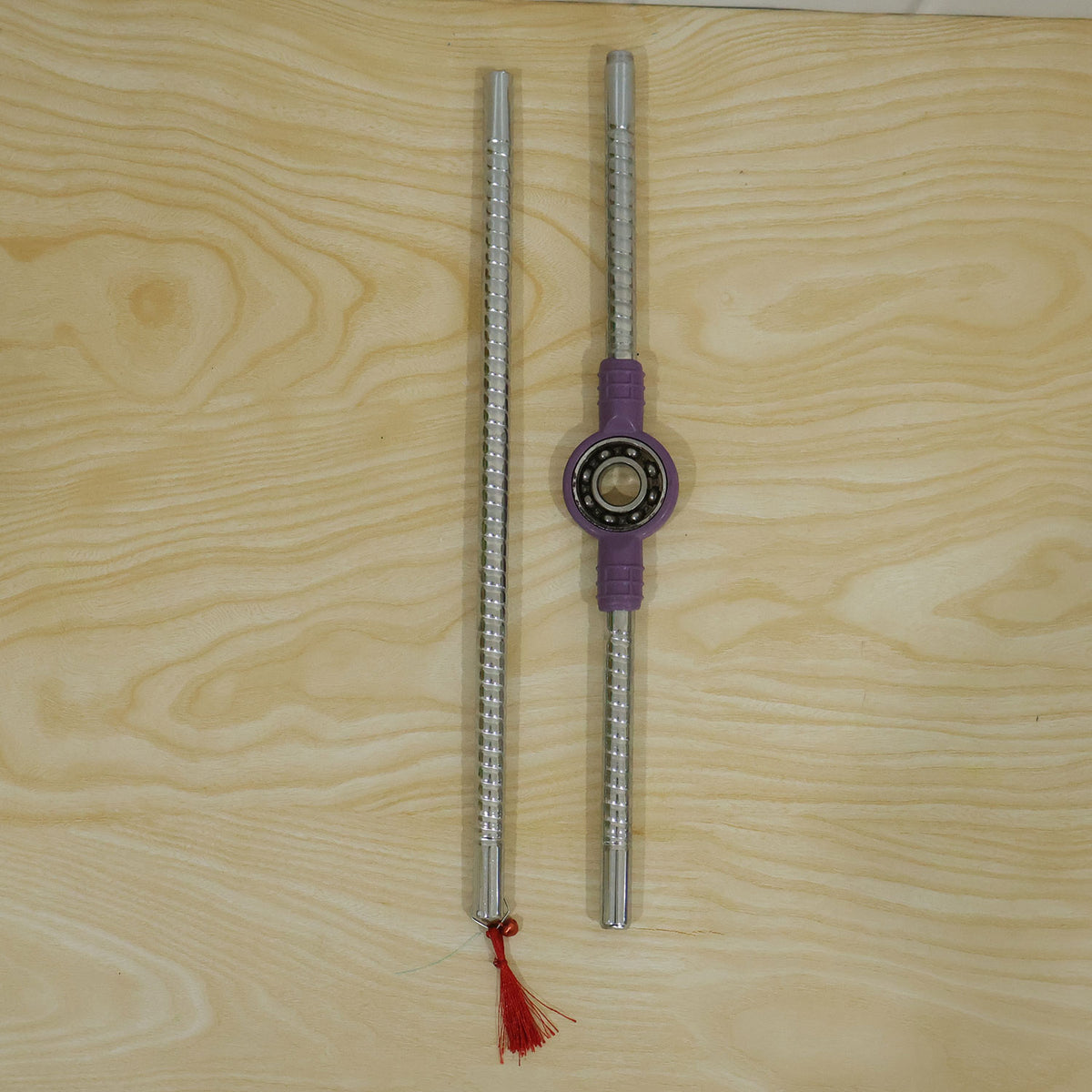 Steel Dandiya Stick Pair With Bearing Center Textured Grip And Tassel
